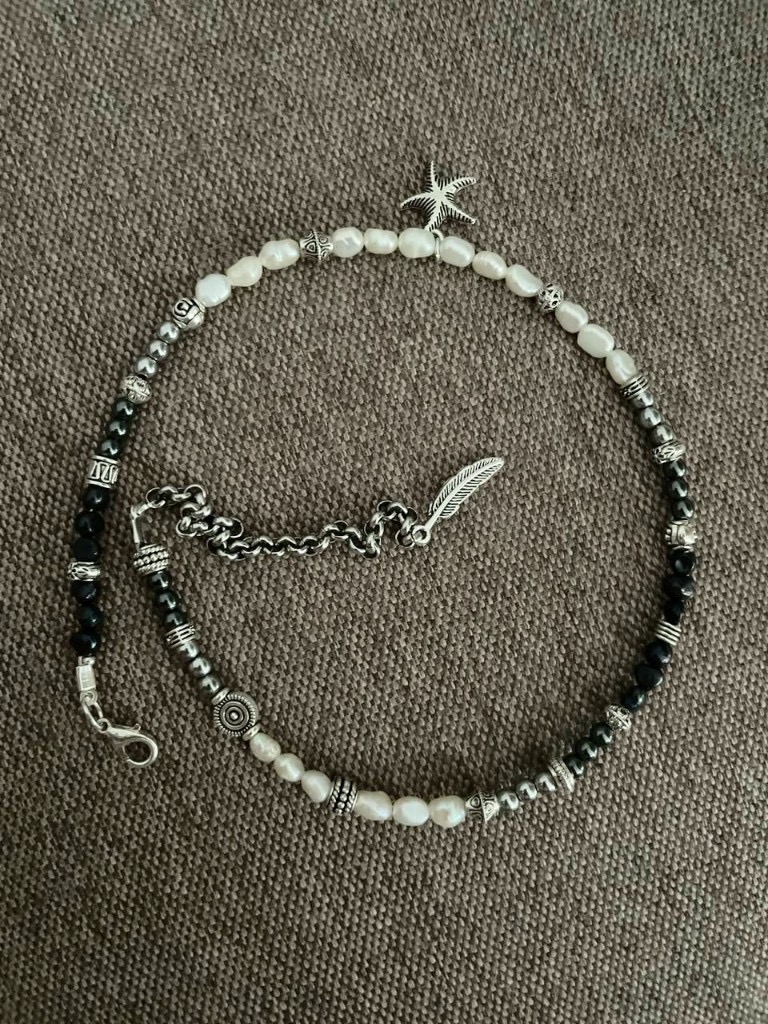 Handmade jewellery with baroque pearls, shells and silver charms